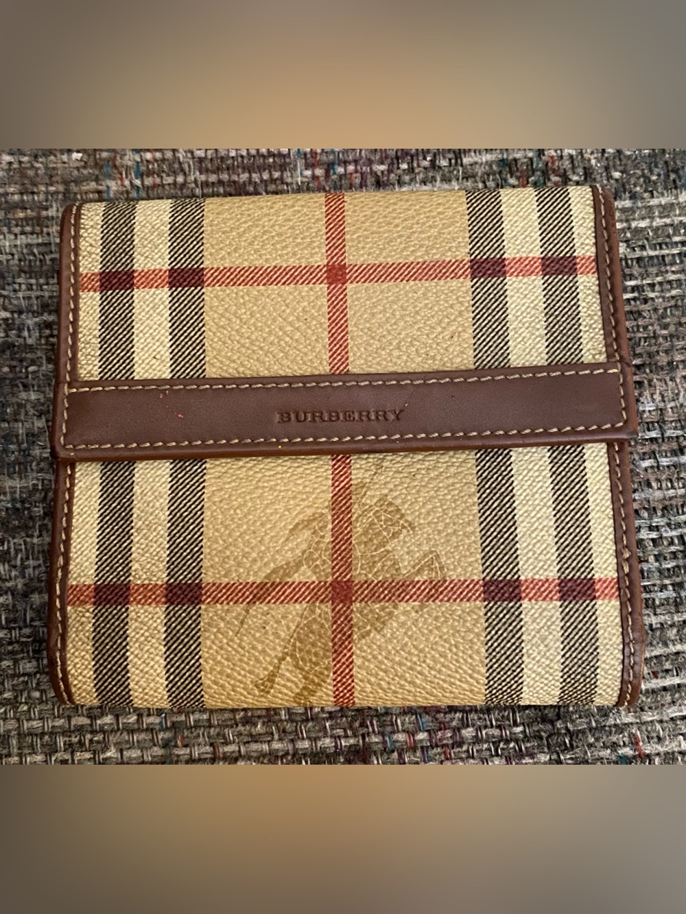 Compact Burberry fold wallet in signature beige check.